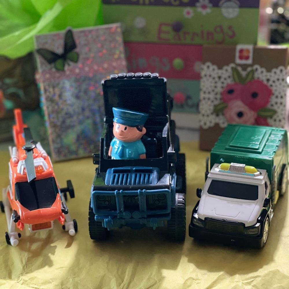 Toy bundle of 3, 2 trucks and 1 helicopter.